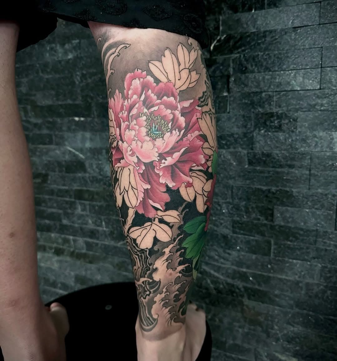 Detailed floral tattoo work by Pine Ink Tattoo